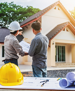 men planning at house construction site